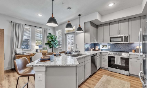 Kitchen and living area in a 2-bedroom apartment at Pyland Ranch
