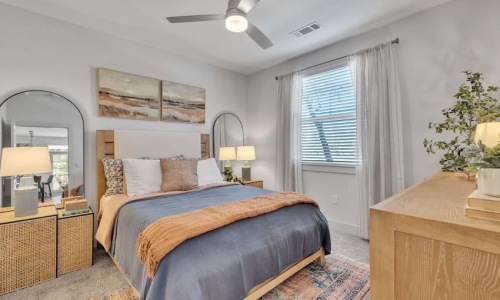 One-bedroom apartment bedroom at Pyland Ranch in San Marcos, TX